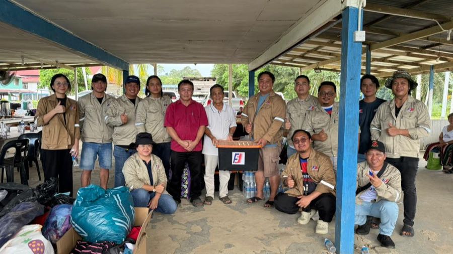Fastart team with community representatives during the handover of aid