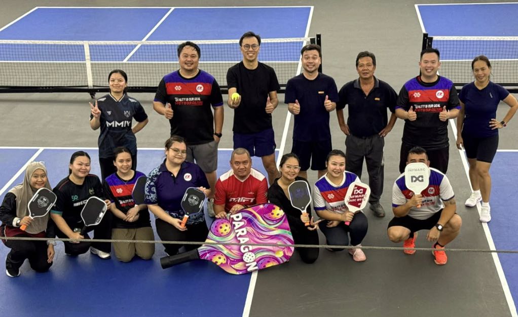 Fastart team members together on the pickleball court