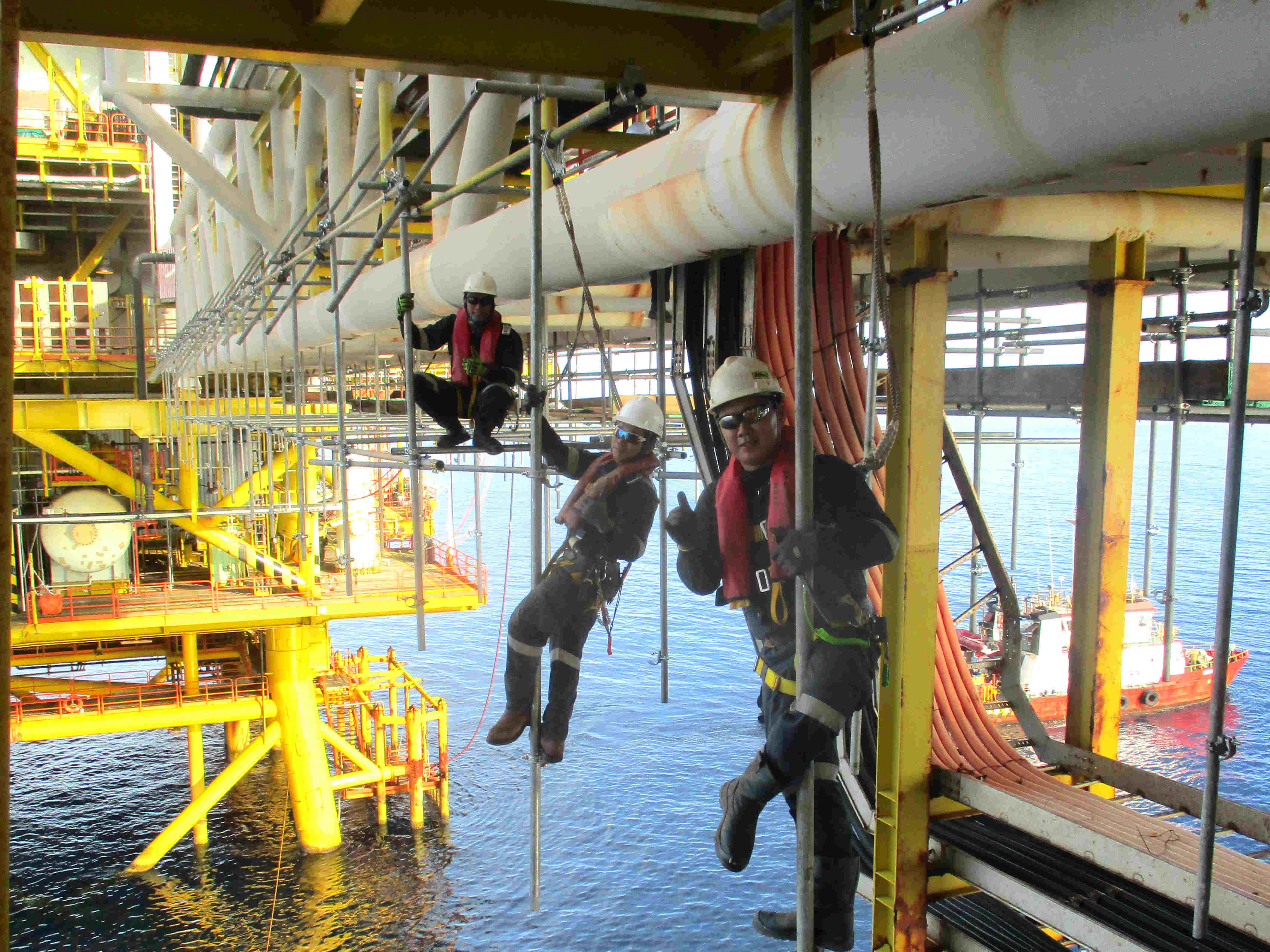 Blasting and painting operations on offshore structure